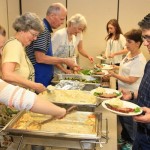 Church volunteers serve dinner